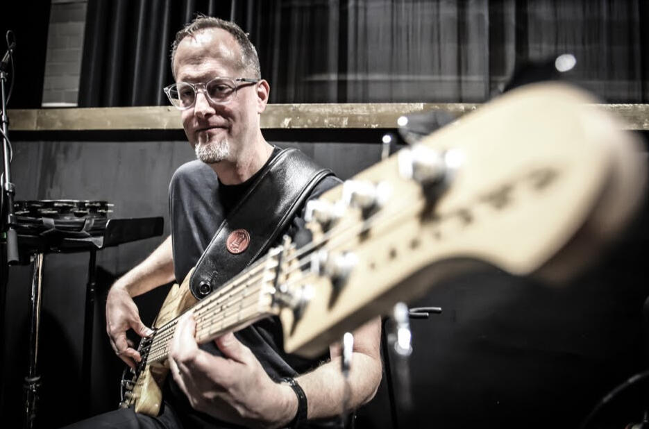 John playing bass at a live gig